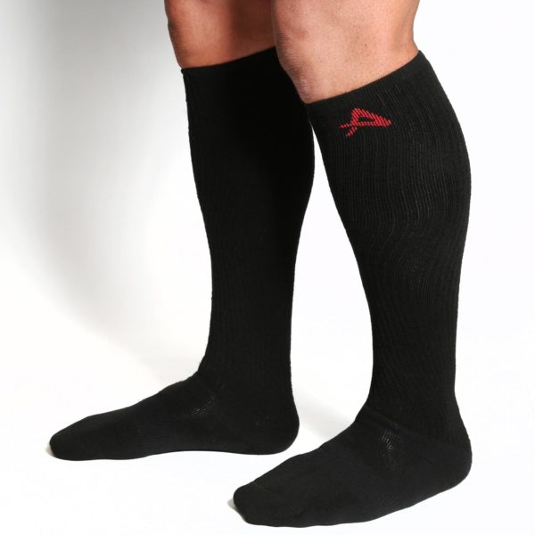 Mans legs with knee-high Akeso socks