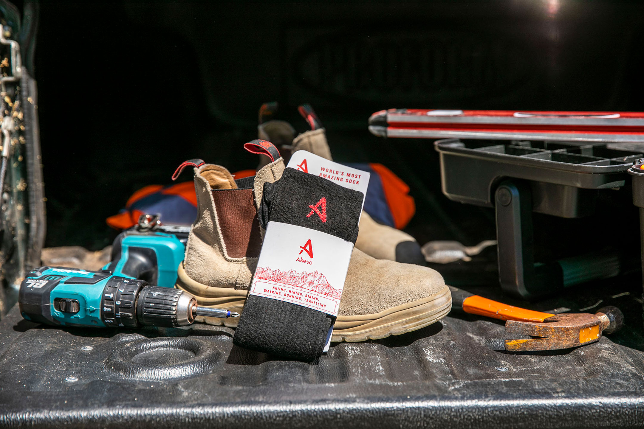 Akeso socks in back of truck with tools